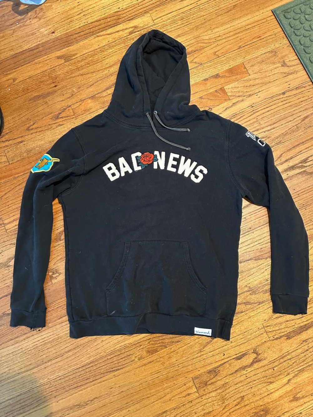 Diamond Supply Co. Black Crewneck "Bad News" Sweatshirt with Rose Accent